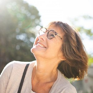 Lady smiles at the sun