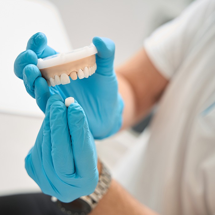 Dentist discussing procedure with patient in dental chair