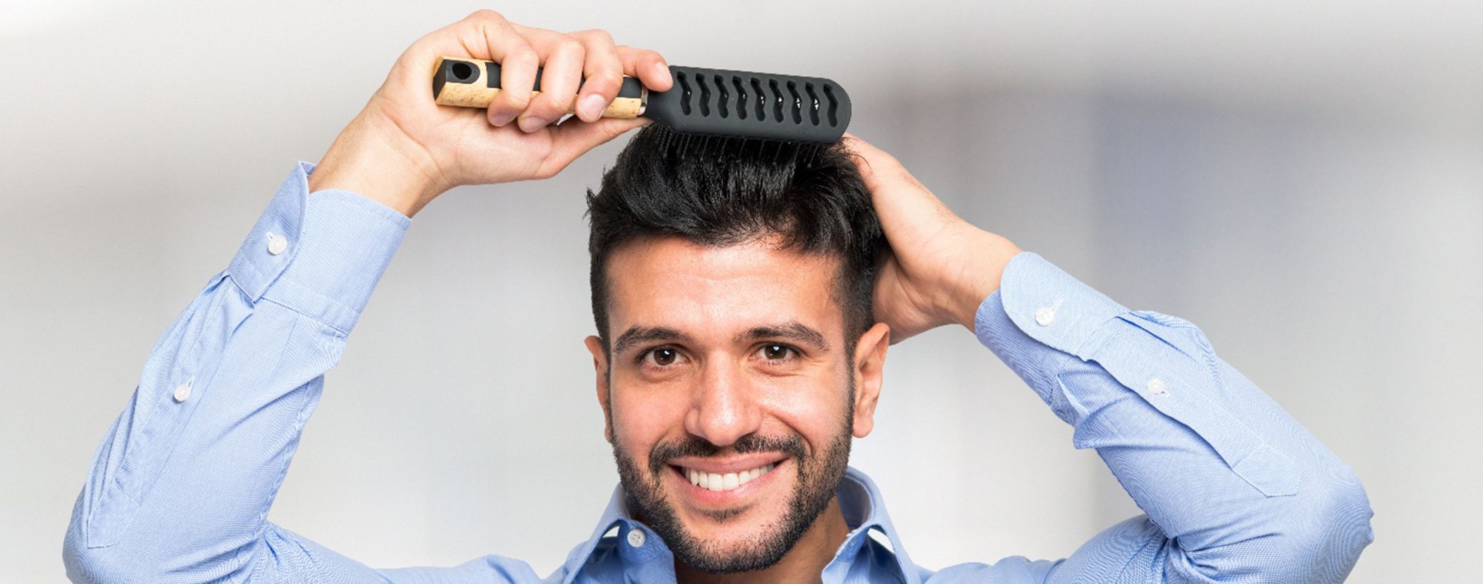 Man brushing his hair