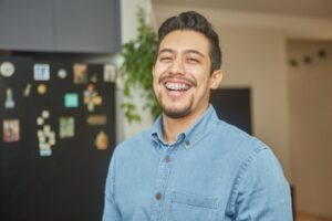 Man smiling with braces